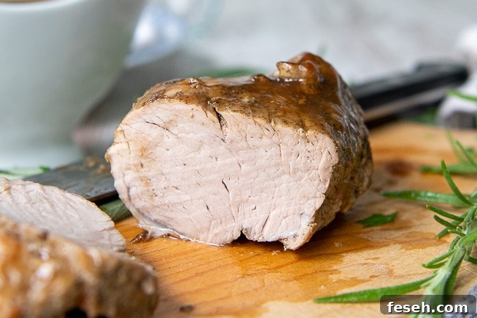 instant pot pork tenderloin on a wooden cutting board 