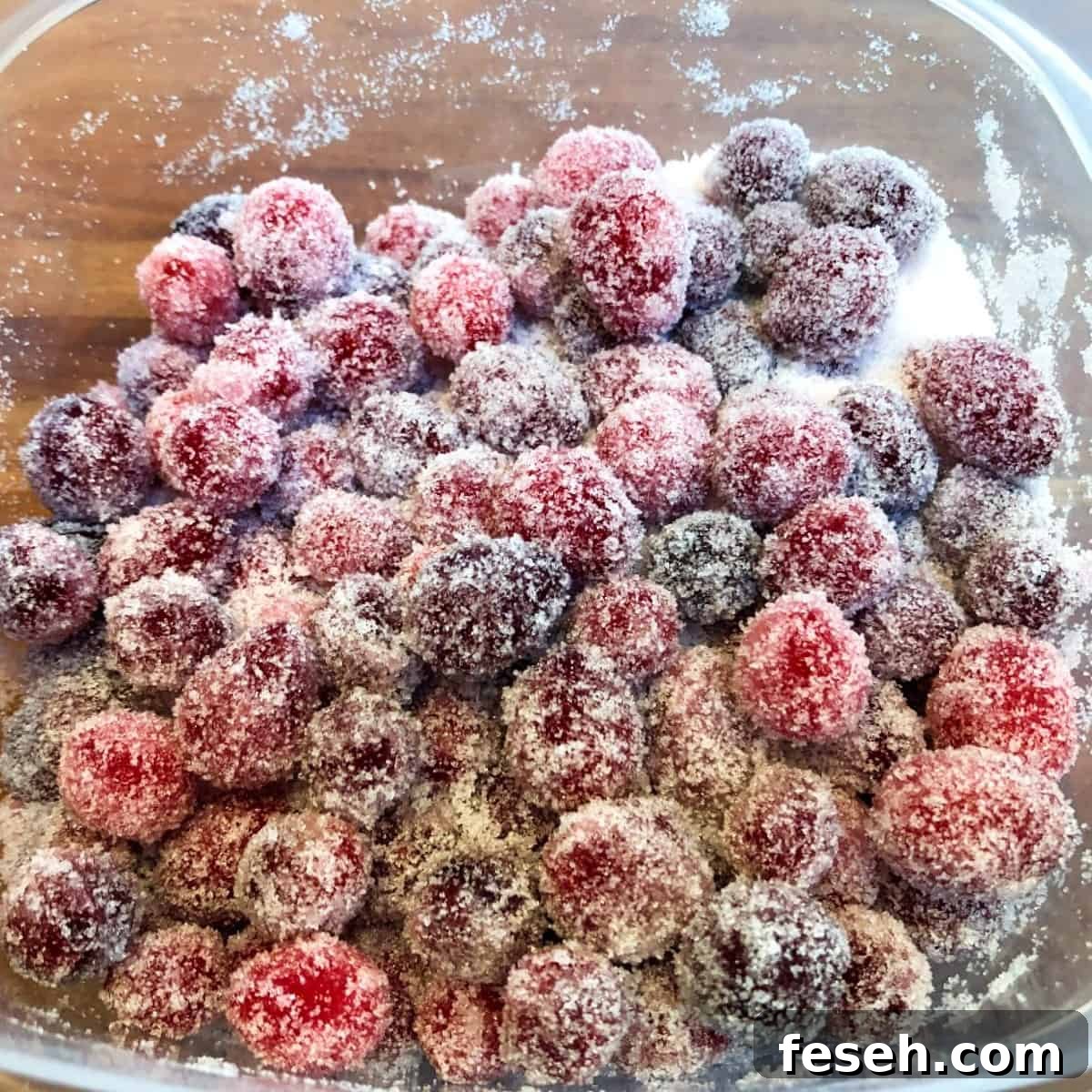 sugared cranberries in a container.