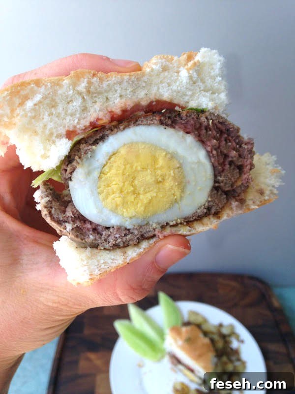 Whip up this scotch egg breakfast burger recipe for a protein packed meal to power you through 'til lunch!