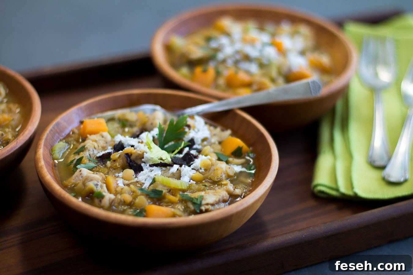 Chicken, Lentil & Butternut Squash Chili Recipe for Fall Nights 8 Chili topped with crushed tortillas, herbs, sour cream and cheese