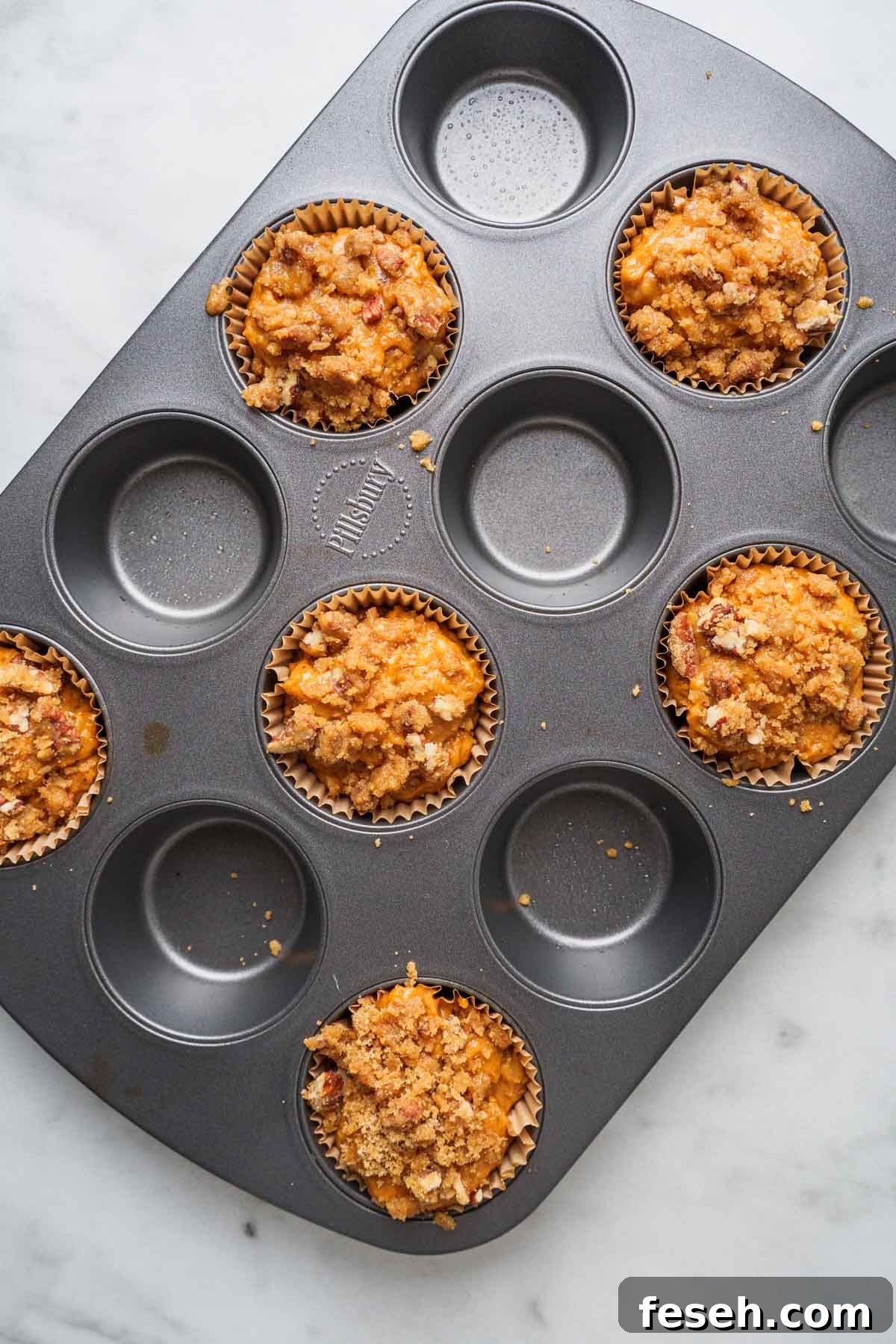 muffin batter in the pan.