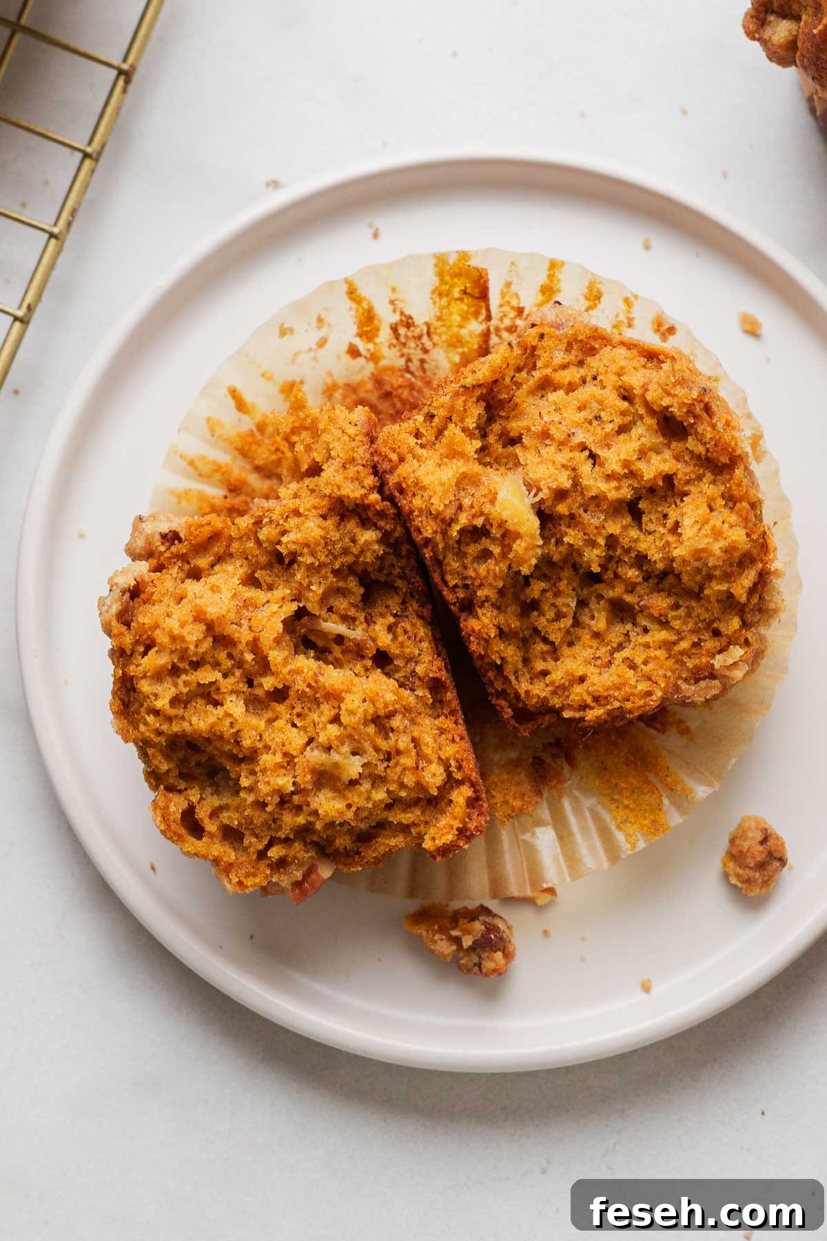 pumpkin banana bread muffin cut in half.
