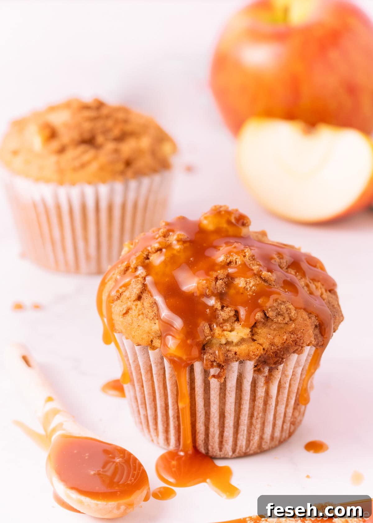 A apple muffin drizzled with rum caramel sauce.