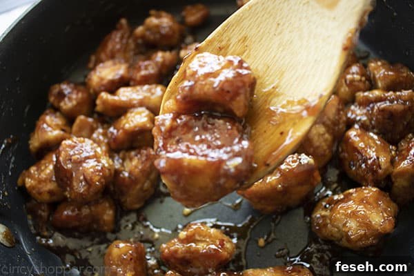 General Tso's Chicken on a wooden spoon.