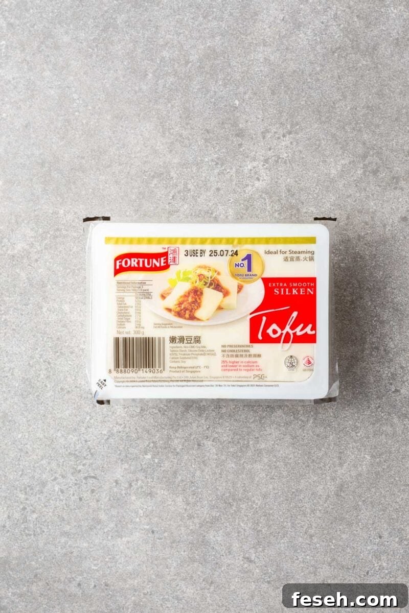 A plastic tub with soft silken tofu.