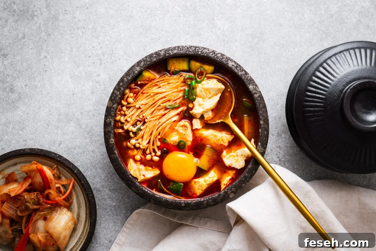 Korean soft tofu stew served with an egg yolk.