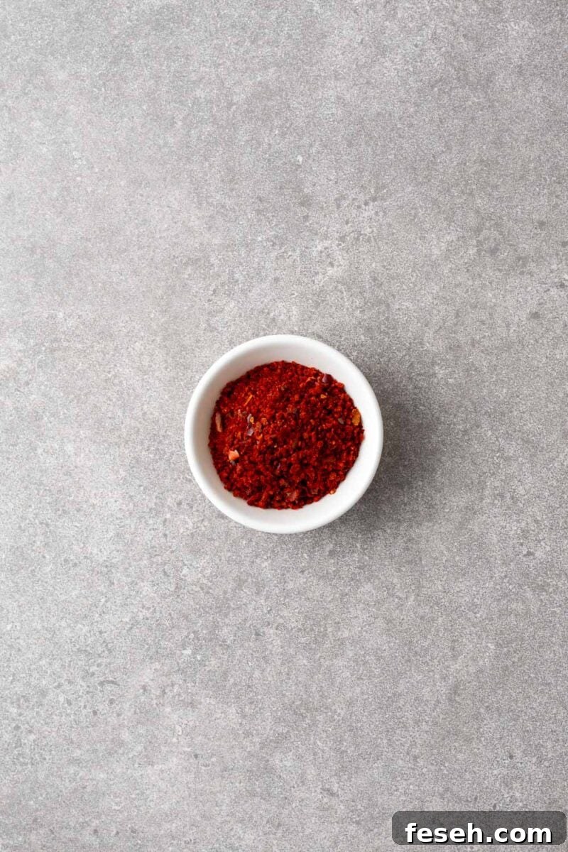 A small bowl with gochugaru flakes (Korean red pepper flakes).