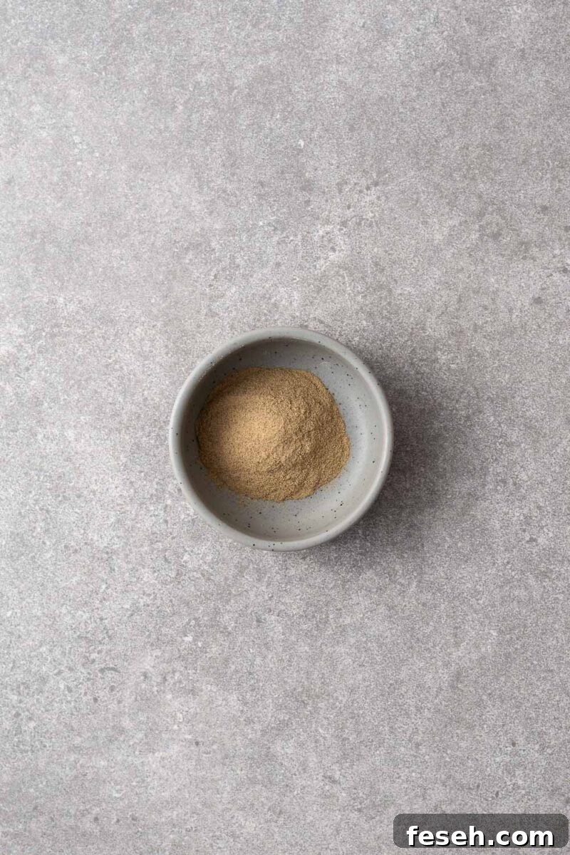 A small bowl with ground white pepper.