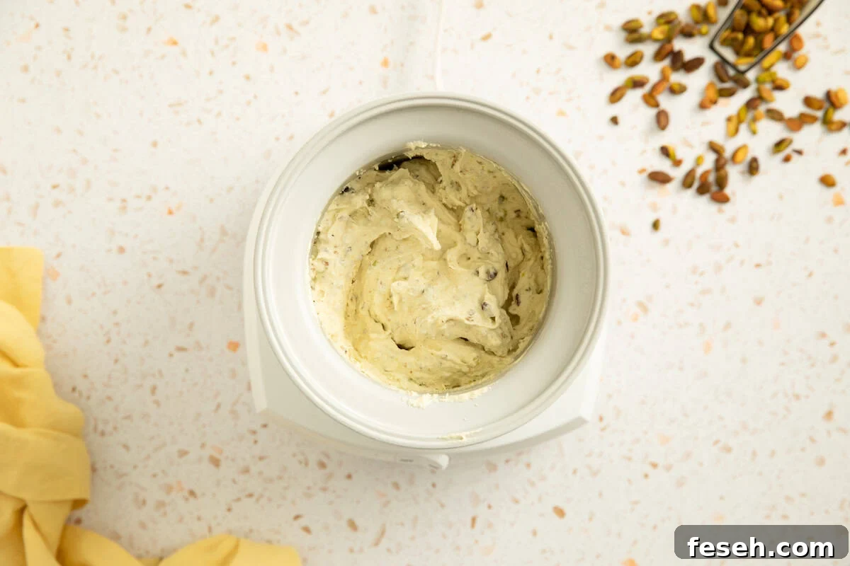 Pistachio ice cream that has finished churning in an ice cream maker