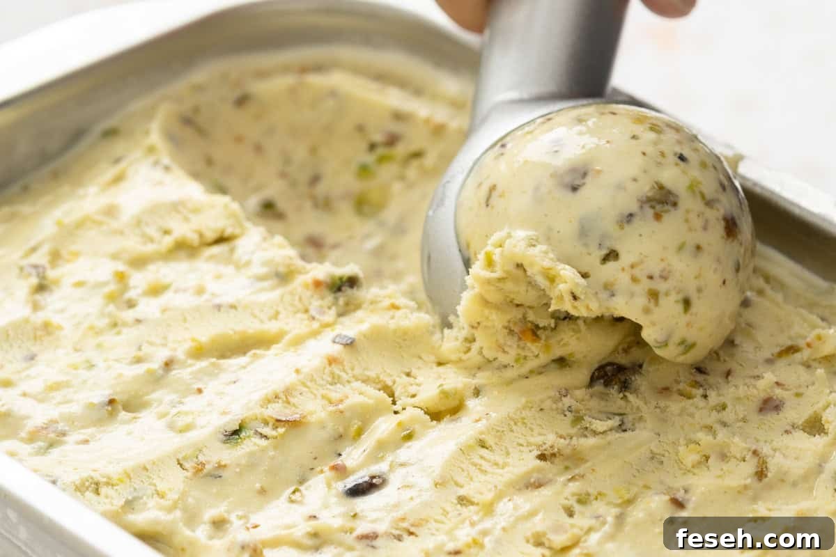 Pistachio ice cream being scooped 