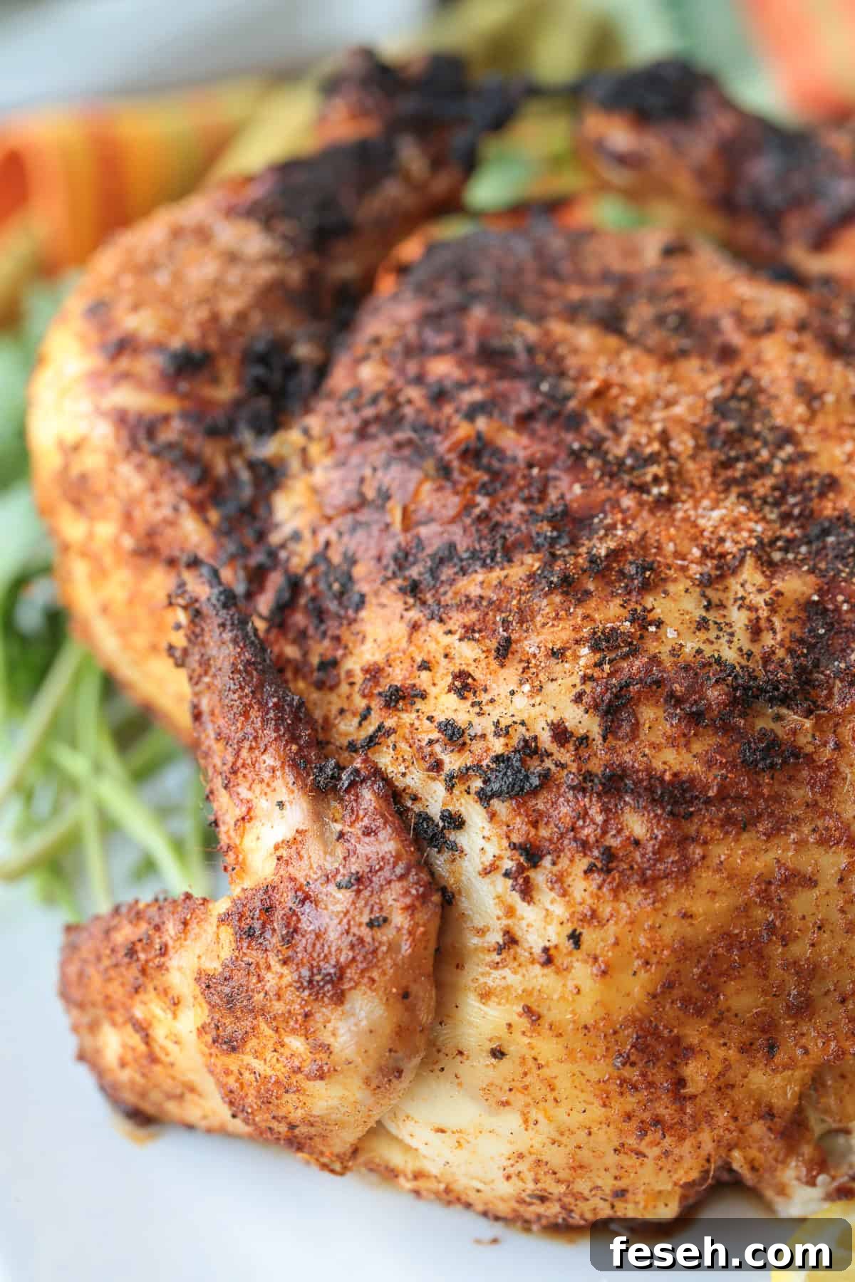 rotisserie chicken on platter with parsley