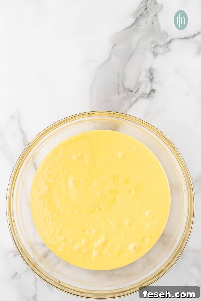 A bowl of yellow batter.