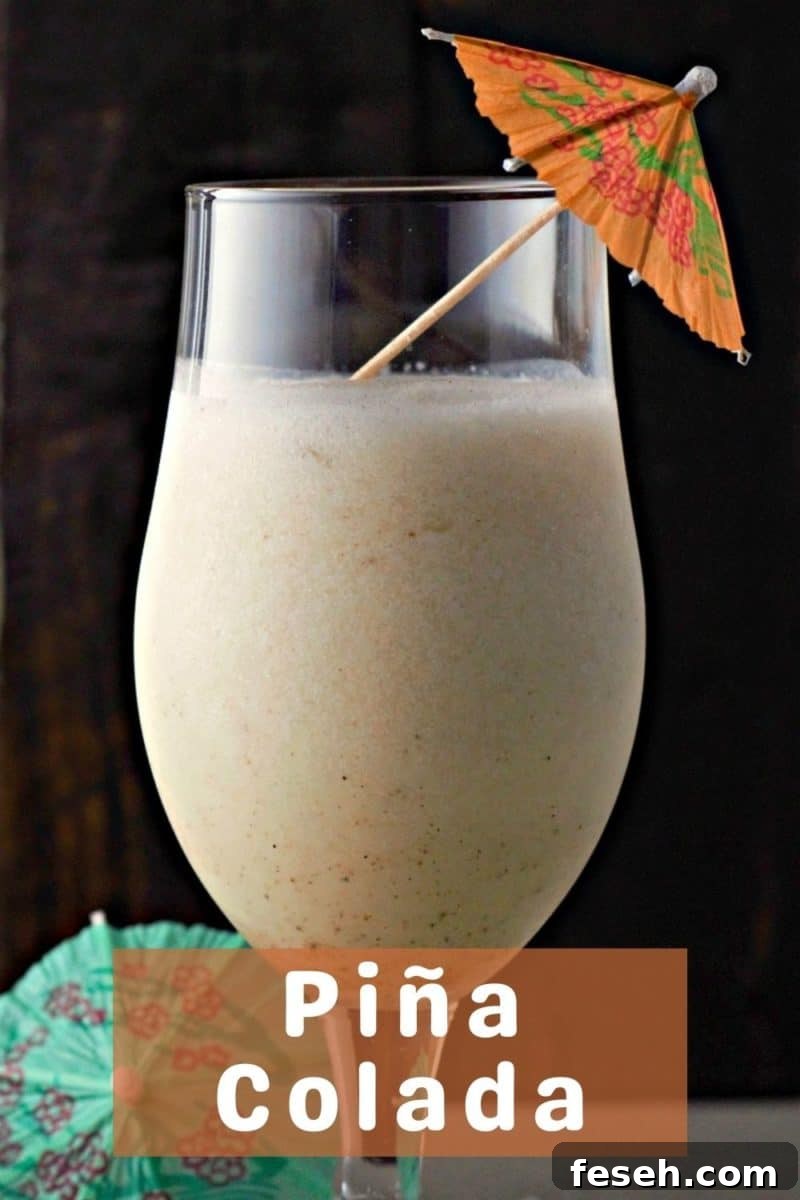 a Pina Colada in a tall glass.