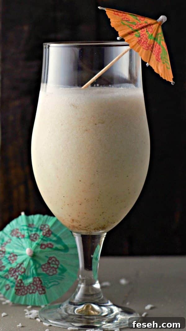 one Pina Colada with an orange umbrella