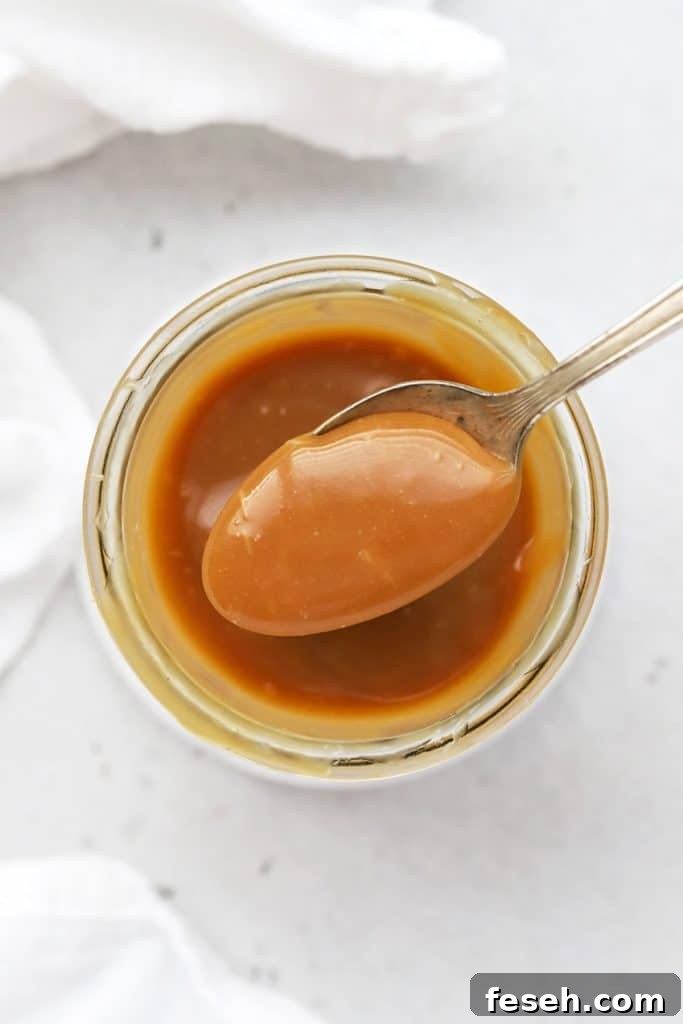 Scooping a spoonful of easy caramel sauce