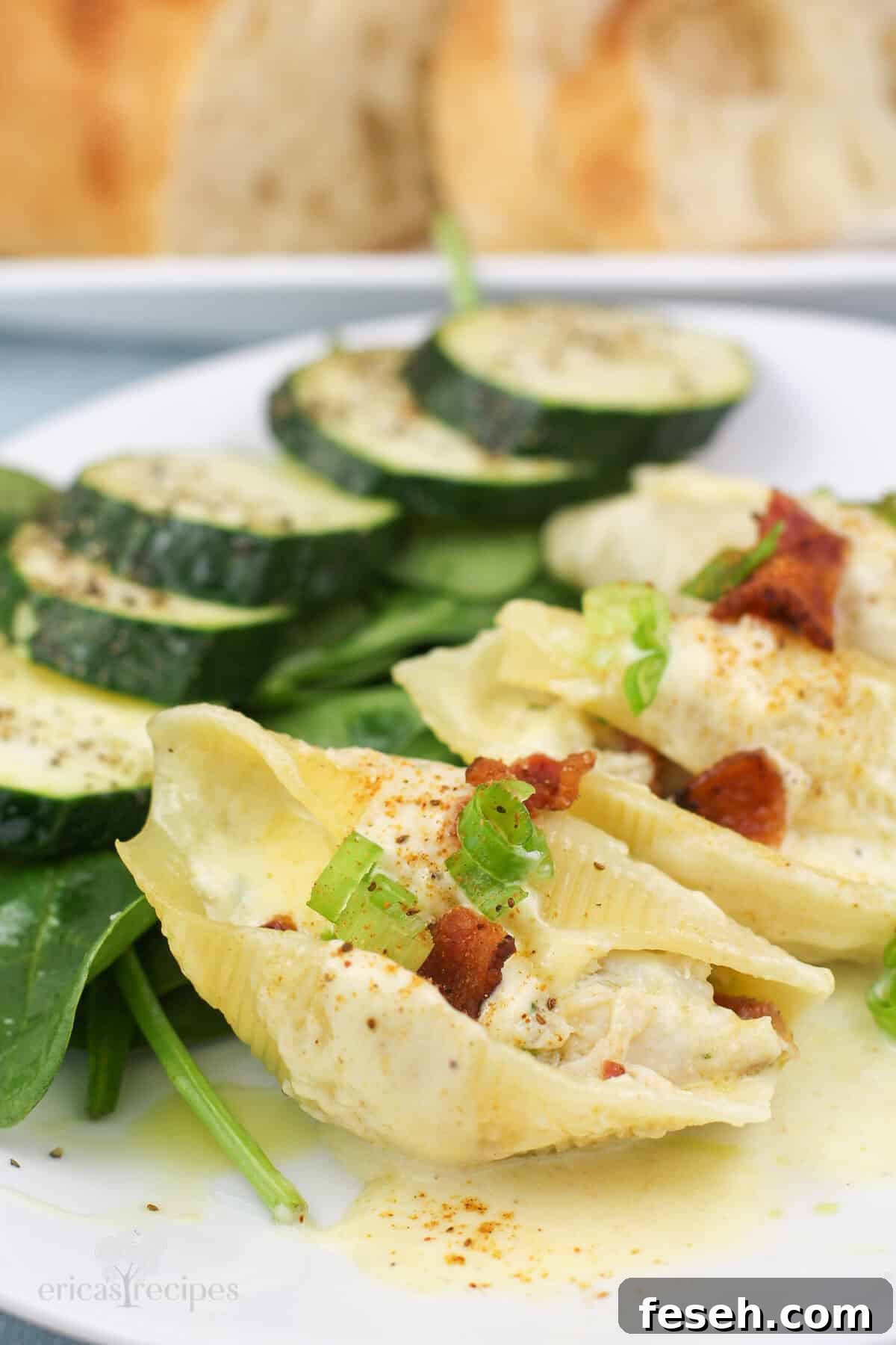 stuffed shells with crab meat on white plate with salad