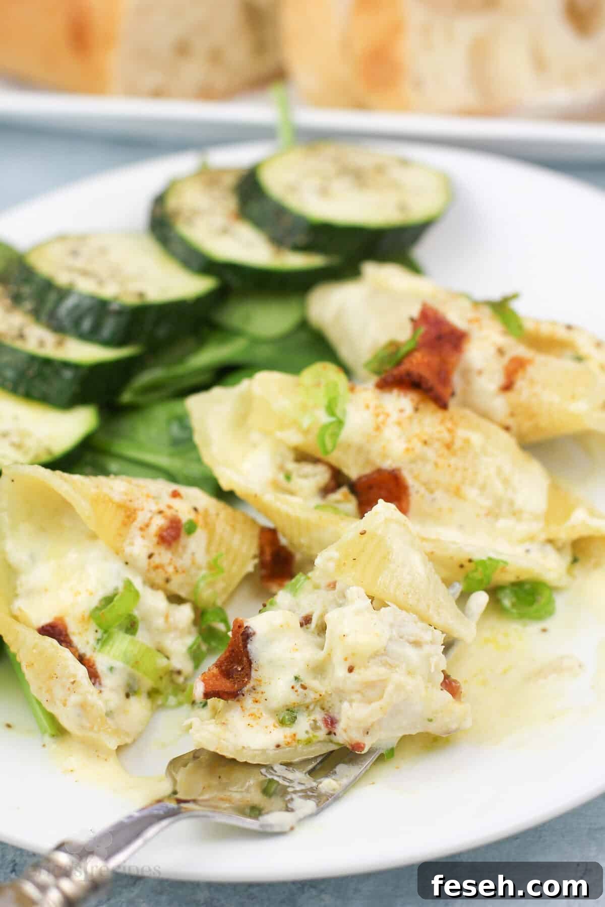 fork holding bite of prepared stuffed shells