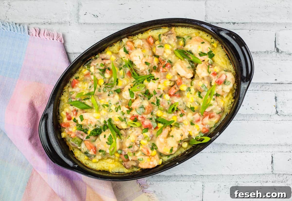 17 Pantry-Friendly Nanna Casseroles That Taste Homemade and Luxurious 11 Shrimp and Grits Casserole in a black dish.
