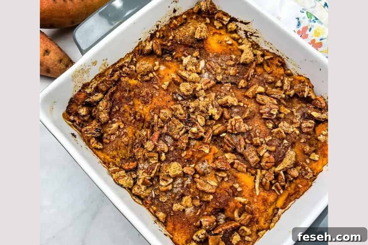 17 Pantry-Friendly Nanna Casseroles That Taste Homemade and Luxurious 12 A close-up of Sweet Potato Casserole on a white dish.