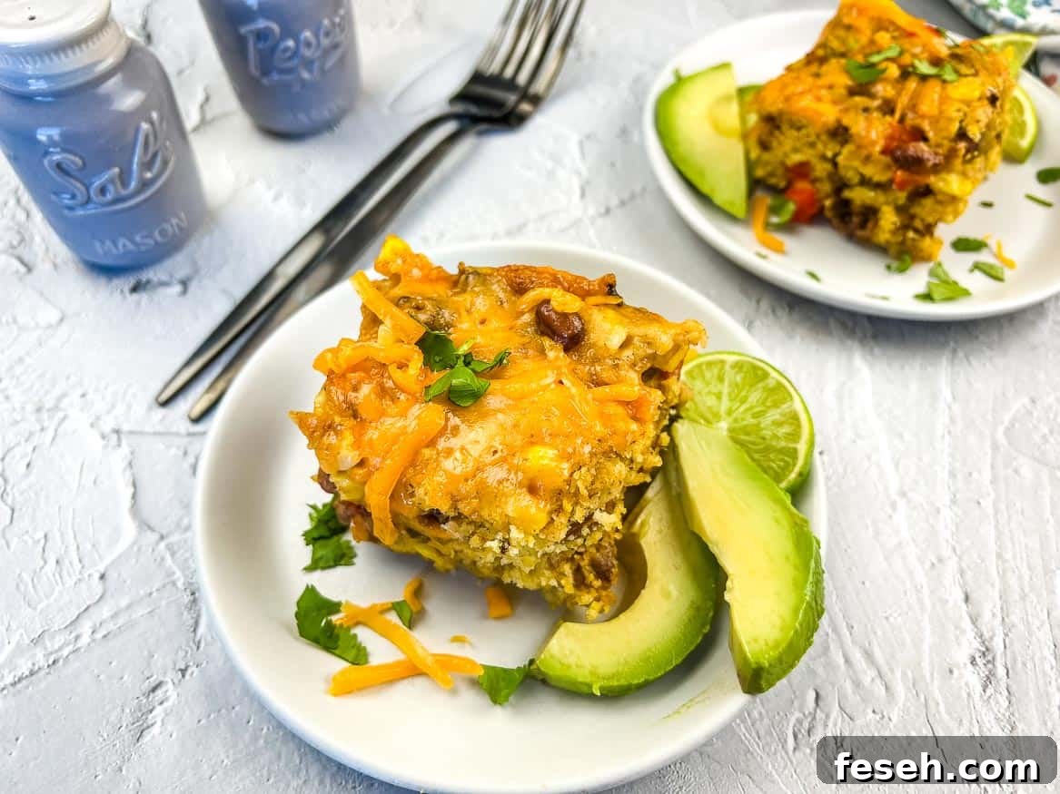 17 Pantry-Friendly Nanna Casseroles That Taste Homemade and Luxurious 15 Two servings of Cowboy Cornbread Casserole on plates.