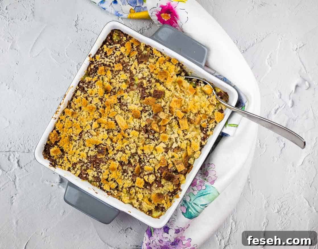 17 Pantry-Friendly Nanna Casseroles That Taste Homemade and Luxurious 17 Corned Beef Hash Casserole in a square baking dish.