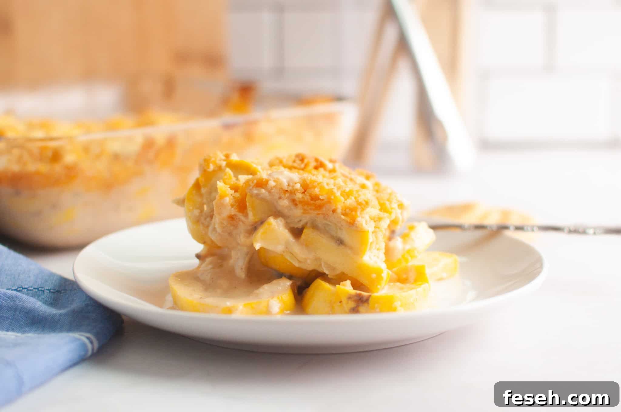 17 Pantry-Friendly Nanna Casseroles That Taste Homemade and Luxurious 4 A serving of squash casserole with a crumb topping is plated on a white dish.