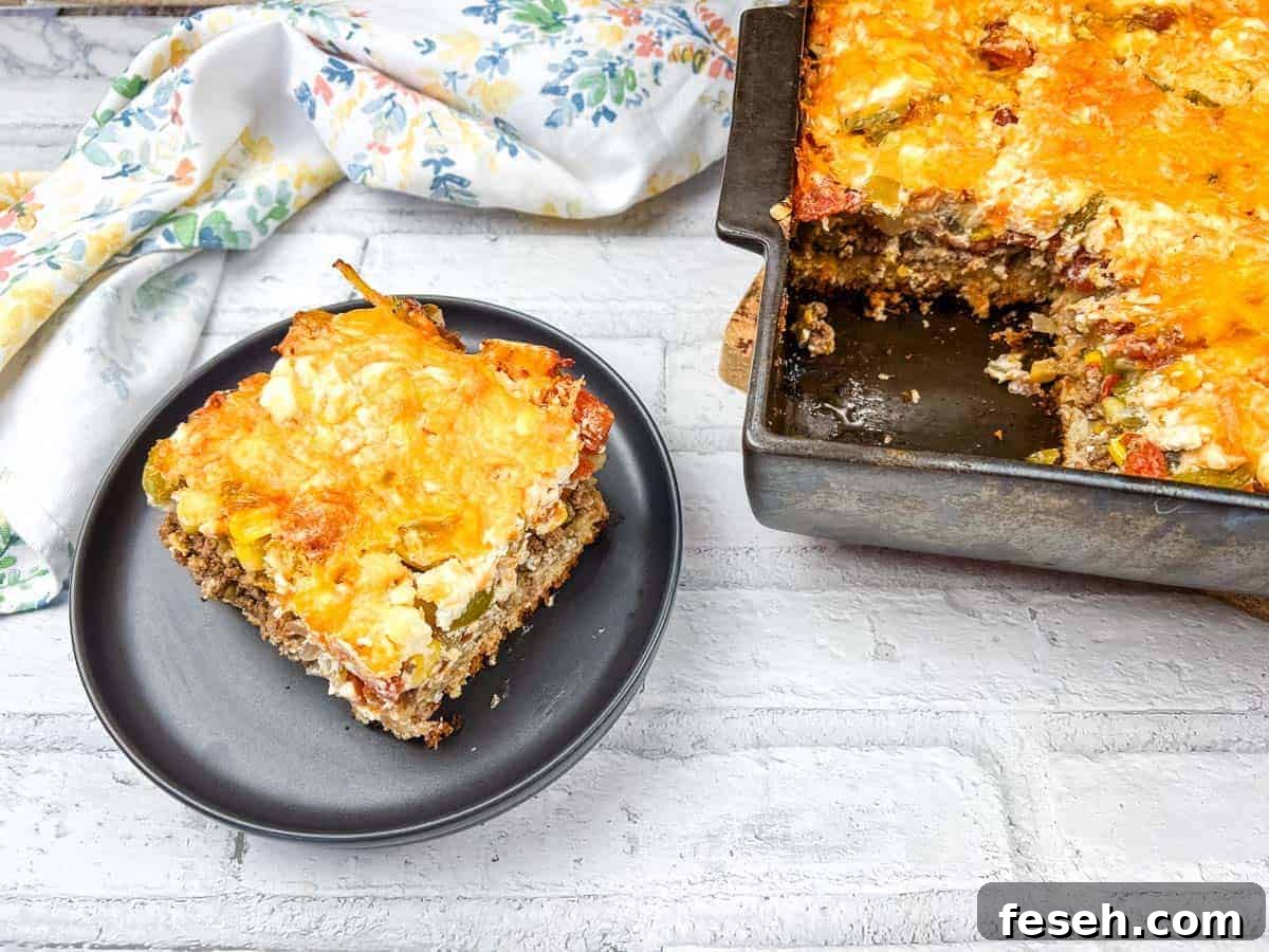 17 Pantry-Friendly Nanna Casseroles That Taste Homemade and Luxurious 7 A slice of John Wayne casserole on a black plate beside a baking dish of the same casserole.
