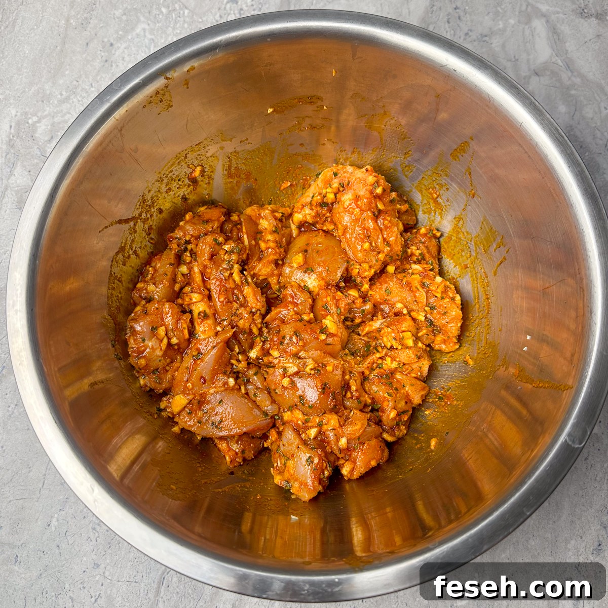 Marinate the cubed chicken thighs