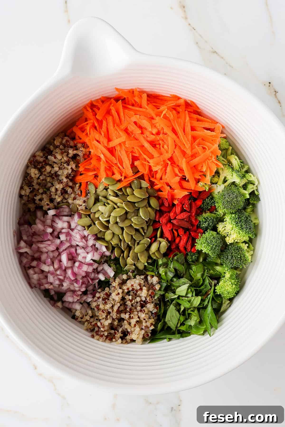 Salad ingredients in a mixing bowl.