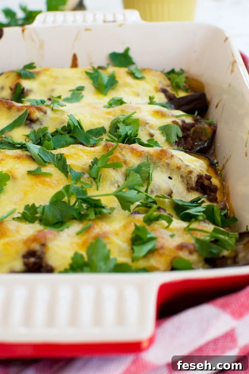 A close up of a baking dish of Greek stuffed eggplant (papoutsakia)