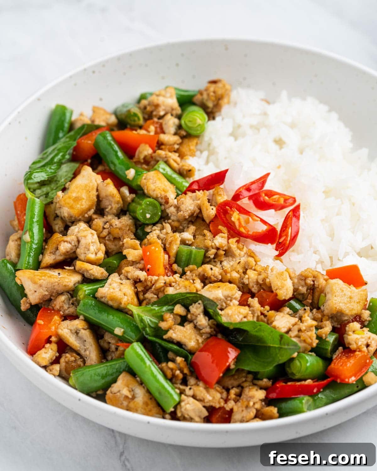 Thai basil tofu pad kra pao on a plate.