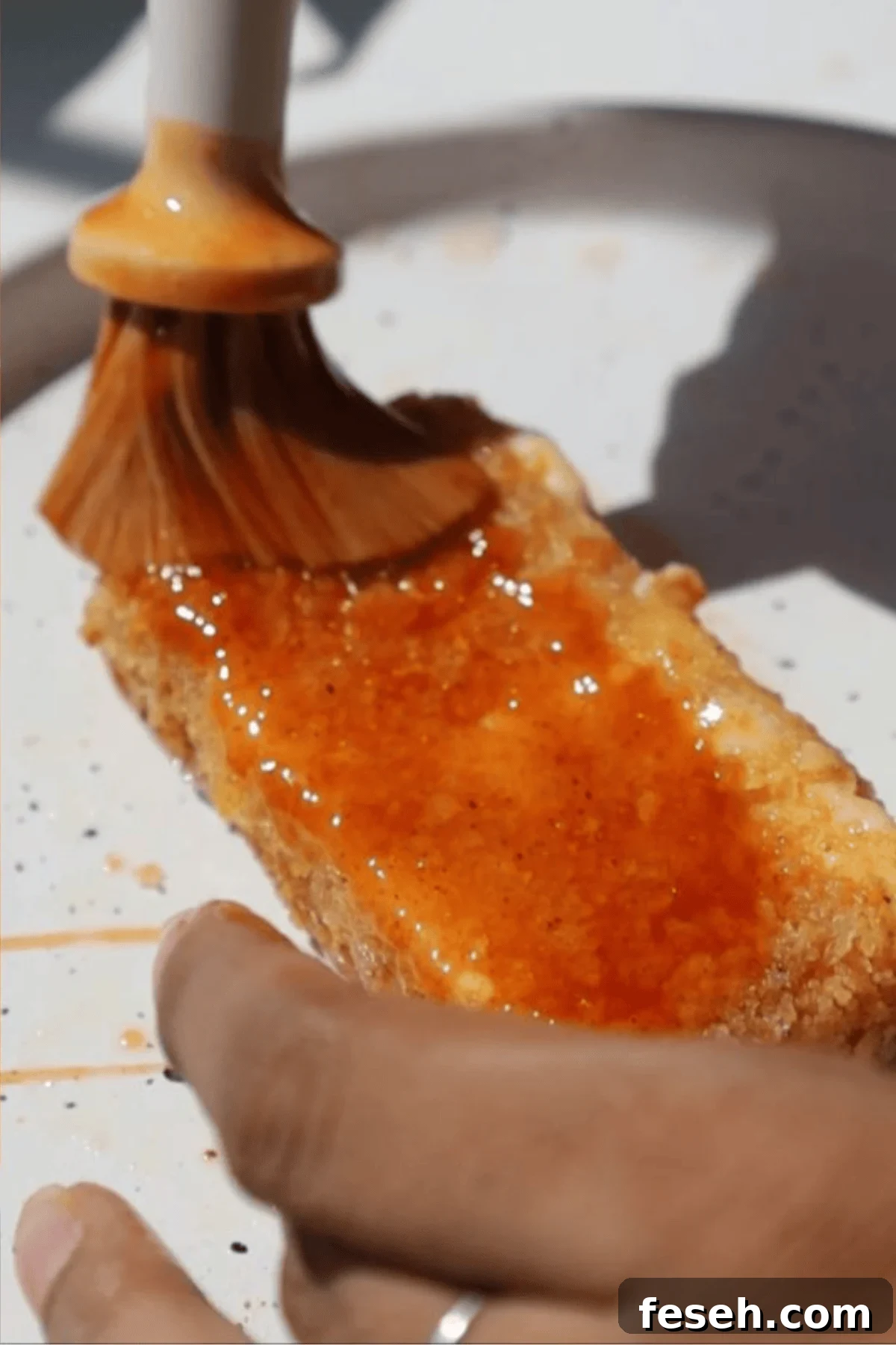 Spicy Honey Mozzarella Sticks Recipe (Video Included) 7 Step four: coat in sauce.