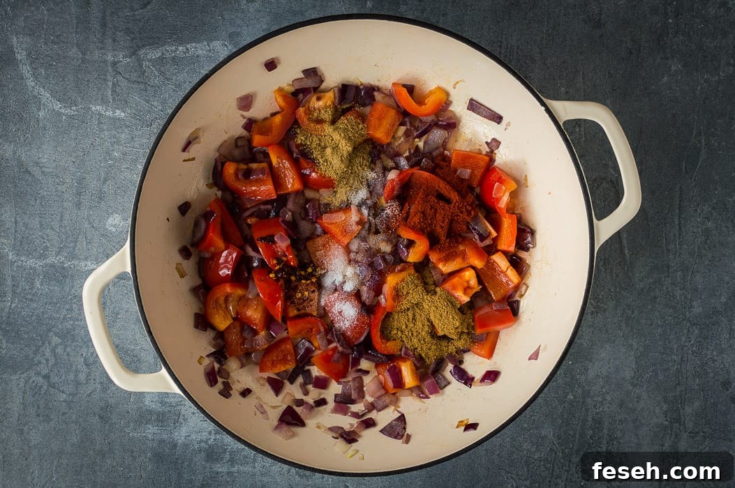 Frying the vegetables and spices.