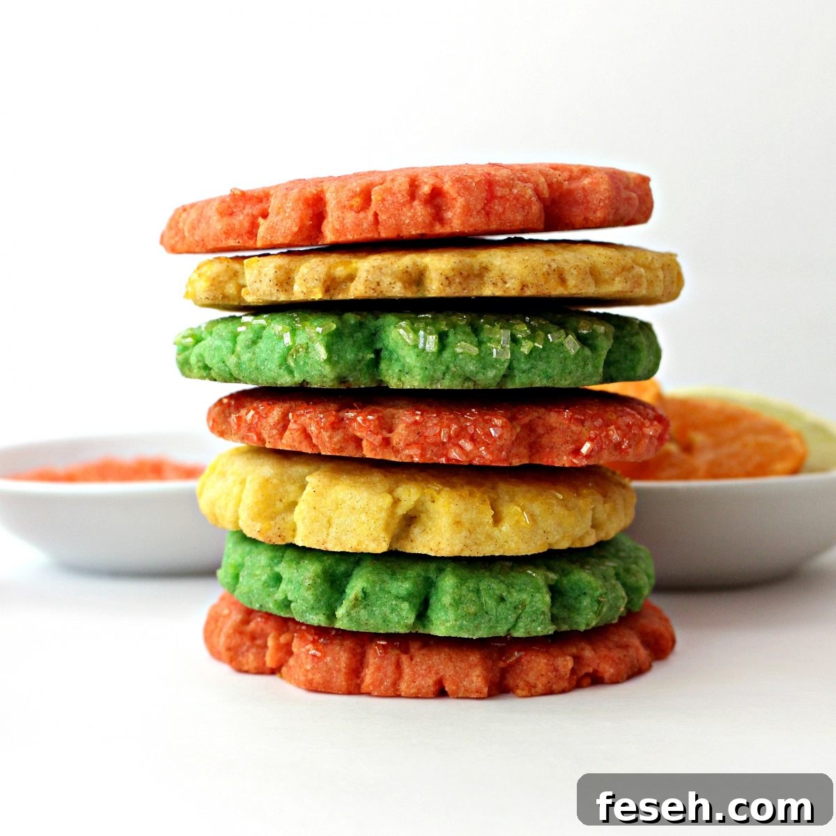 Stack of yellow , green, and orange Mexican Sugar Cookies.