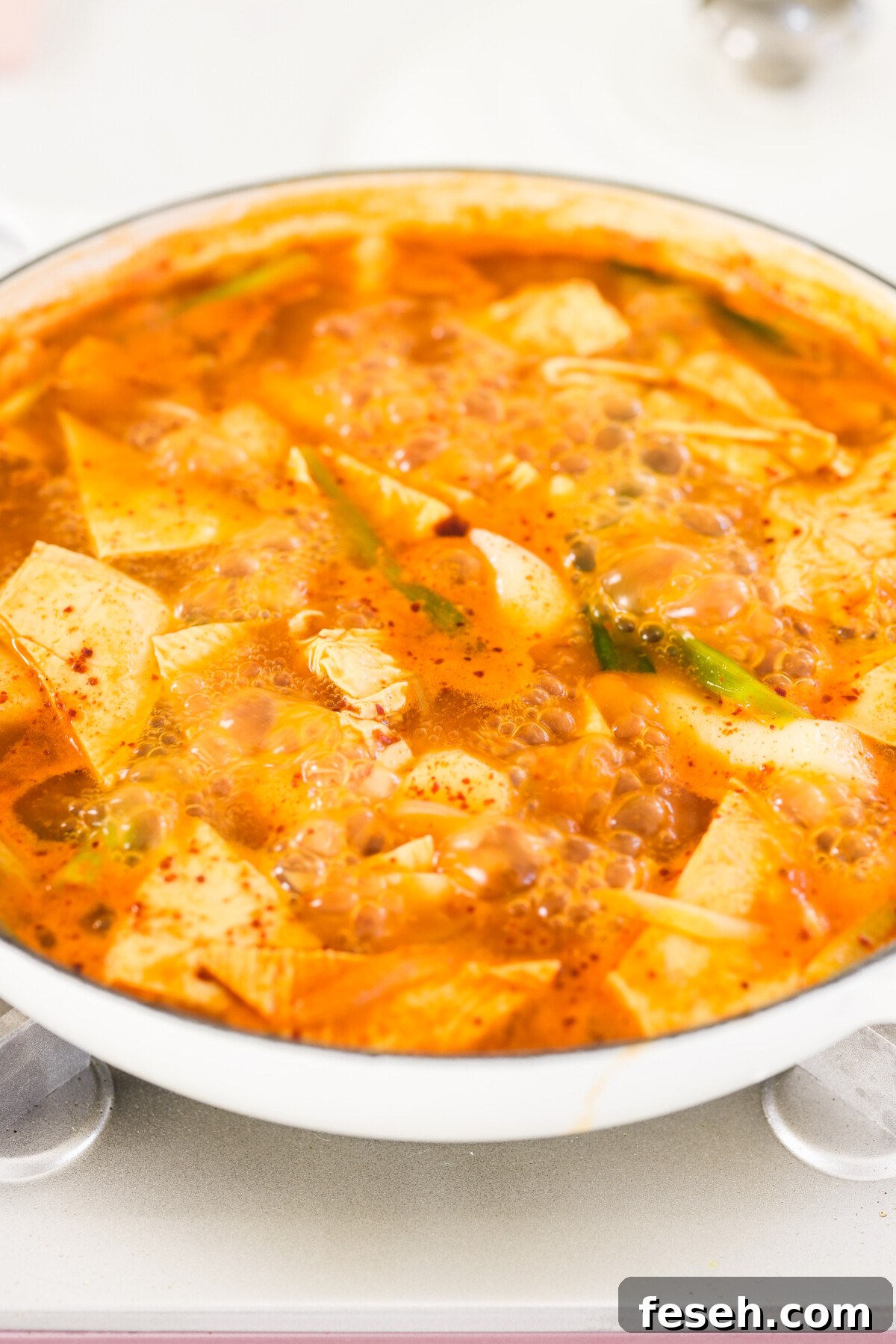 a bowl with spicy rice cakes and gochujang