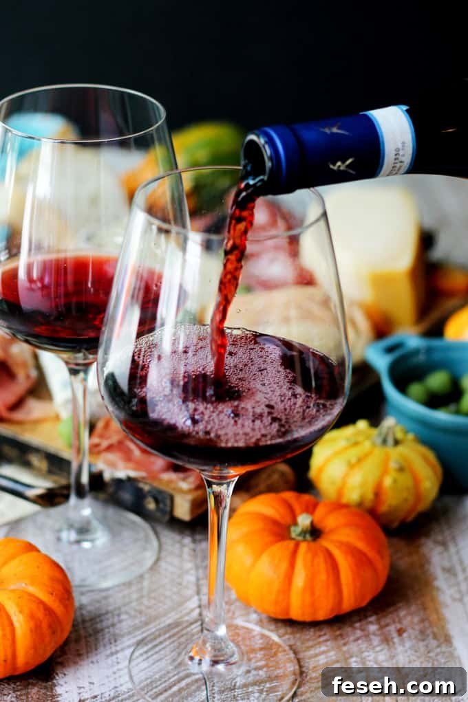 Pouring red Italian wine into a glass