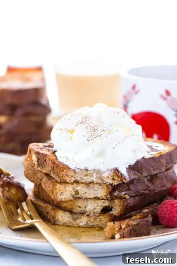 This Gluten Free Eggnog French Toast is the perfect breakfast during the holiday season. You can make it ahead too and reheat it for your holiday brunch! For dairy free, use non-dairy eggnog. Recipe from @whattheforkblog | whattheforkfoodblog.com | recipes for Christmas brunch | gluten free breakfast recipes | easy French toast recipes | #Christmas #frenchtoast #breakfast #glutenfree #easyrecipes #recipe #eggnog #brunch