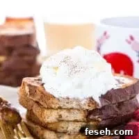 This Gluten Free Eggnog French Toast is the perfect breakfast during the holiday season. You can make it ahead too and reheat it for your holiday brunch! For dairy free, use non-dairy eggnog. Recipe from @whattheforkblog | whattheforkfoodblog.com | recipes for Christmas brunch | gluten free breakfast recipes | easy French toast recipes | #Christmas #frenchtoast #breakfast #glutenfree #easyrecipes #recipe #eggnog #brunch