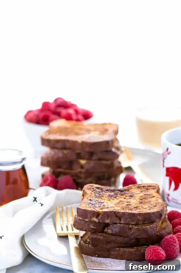 This Gluten Free Eggnog French Toast is the perfect breakfast during the holiday season. You can make it ahead too and reheat it for your holiday brunch! For dairy free, use non-dairy eggnog. Recipe from @whattheforkblog | whattheforkfoodblog.com | recipes for Christmas brunch | gluten free breakfast recipes | easy French toast recipes | #Christmas #frenchtoast #breakfast #glutenfree #easyrecipes #recipe #eggnog #brunch