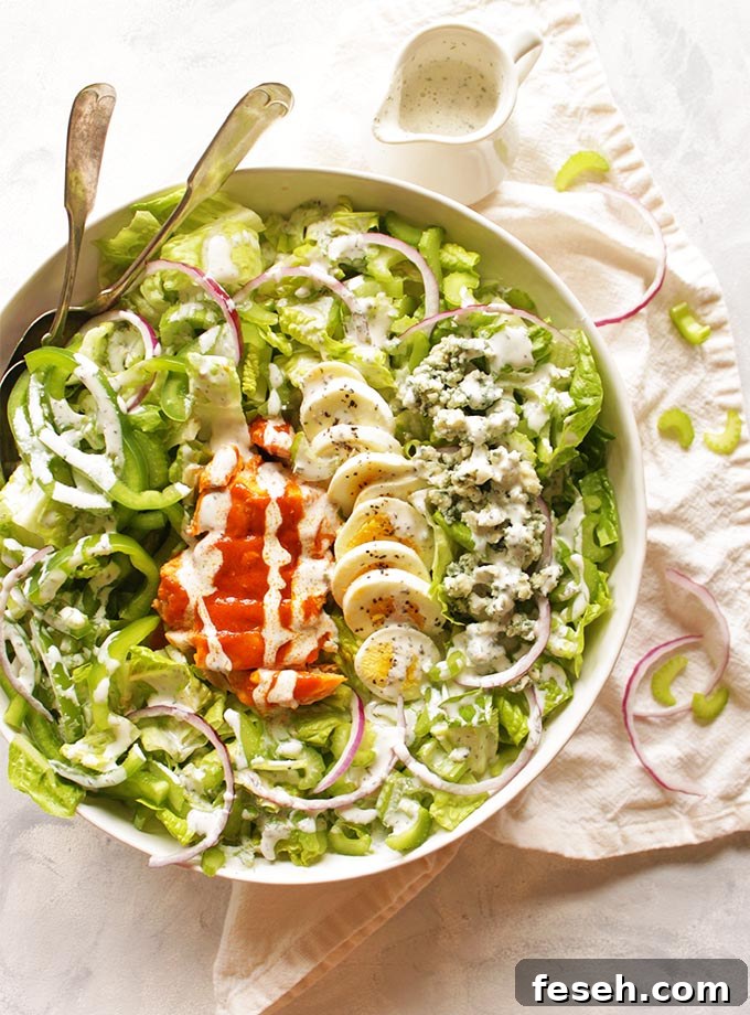 Buffalo Chicken Salad with Greek Yogurt Ranch Dressing - satisfies the craving for buffalo chicken wings only with more veggies. It's packed with crunch, spicy buffalo sauce, and homemade cooling Greek yogurt ranch dressing. So tasty! #Glutenfree #buffalochicken #recipes #salad #healthyfood | robustrecipes.com