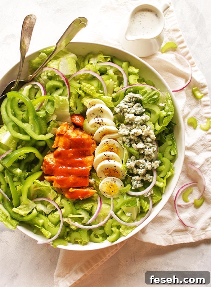 Buffalo Chicken Salad with Greek Yogurt Ranch Dressing - satisfies the craving for buffalo chicken wings only with more veggies. It's packed with crunch, spicy buffalo sauce, and homemade cooling Greek yogurt ranch dressing. So tasty! #Glutenfree #buffalochicken #recipes #salad #healthyfood | robustrecipes.com