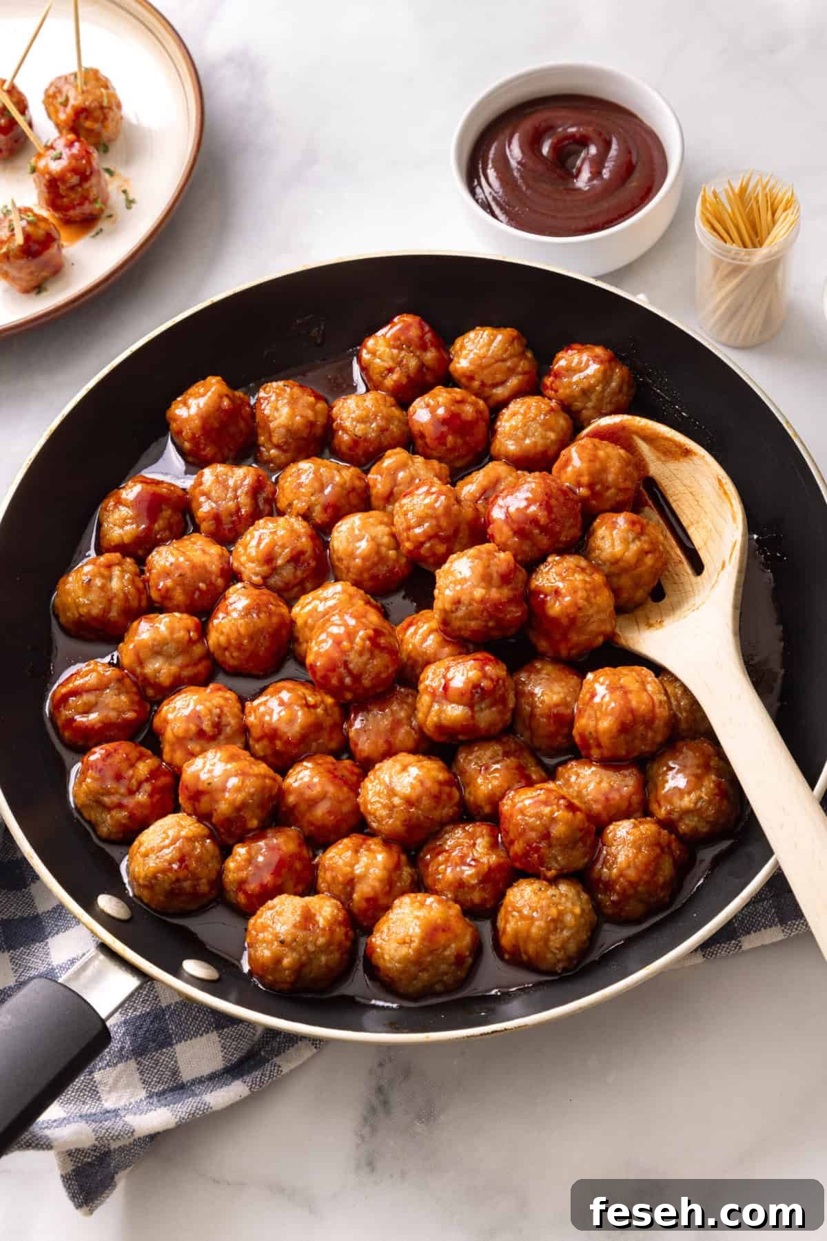grape jelly meatballs in a skillet.
