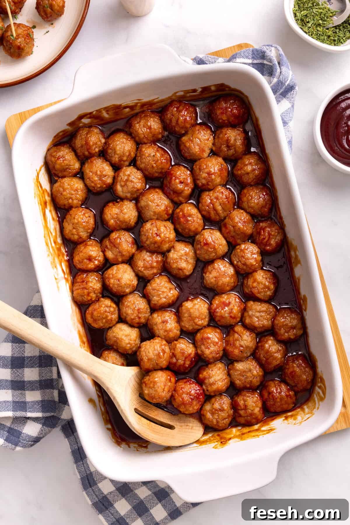 grape jelly meatballs in a casserole dish.