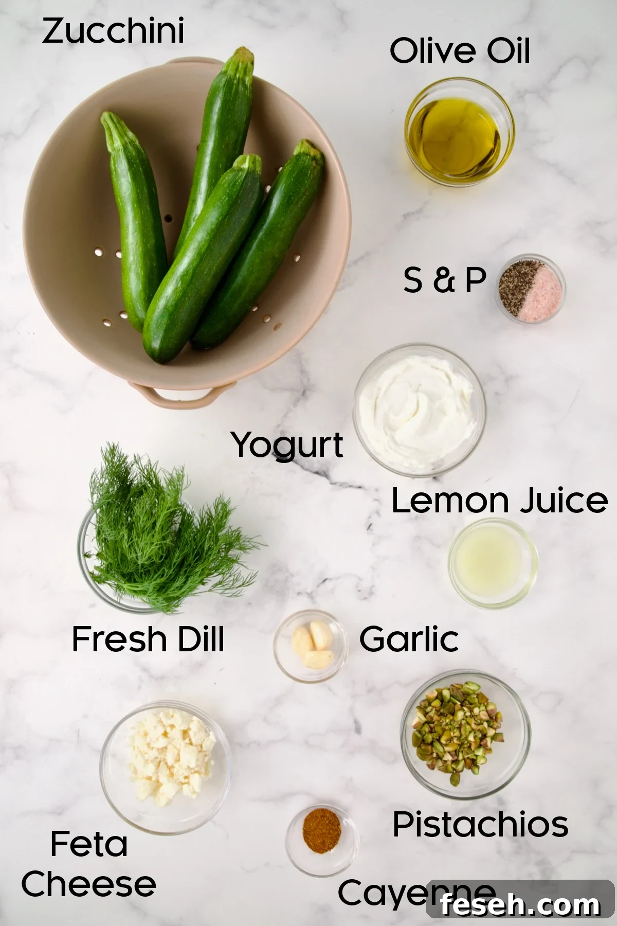 Ingredients for Mediterranean Grilled Zucchini with Dill Yogurt and Feta in glass bowls.