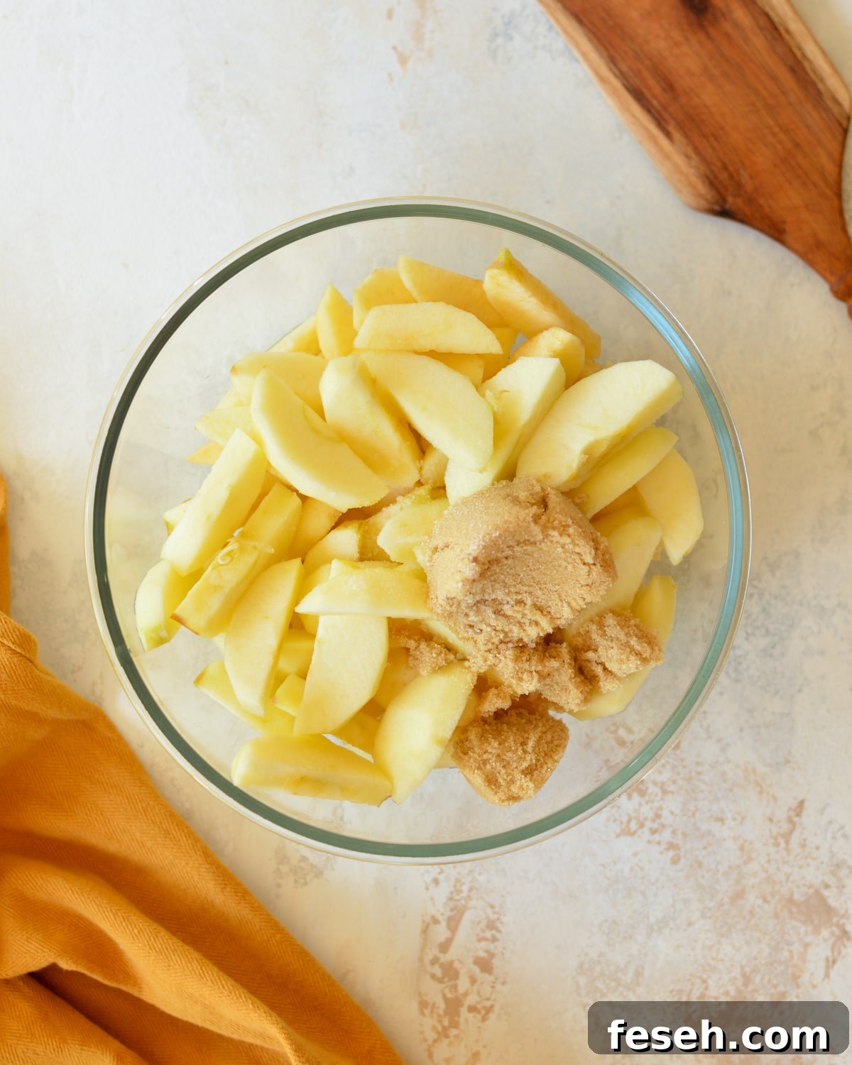 Crispy Apple Crisp (Oat-Free) Recipe for Homemade Dessert 4 a bowl of apples with brown sugar