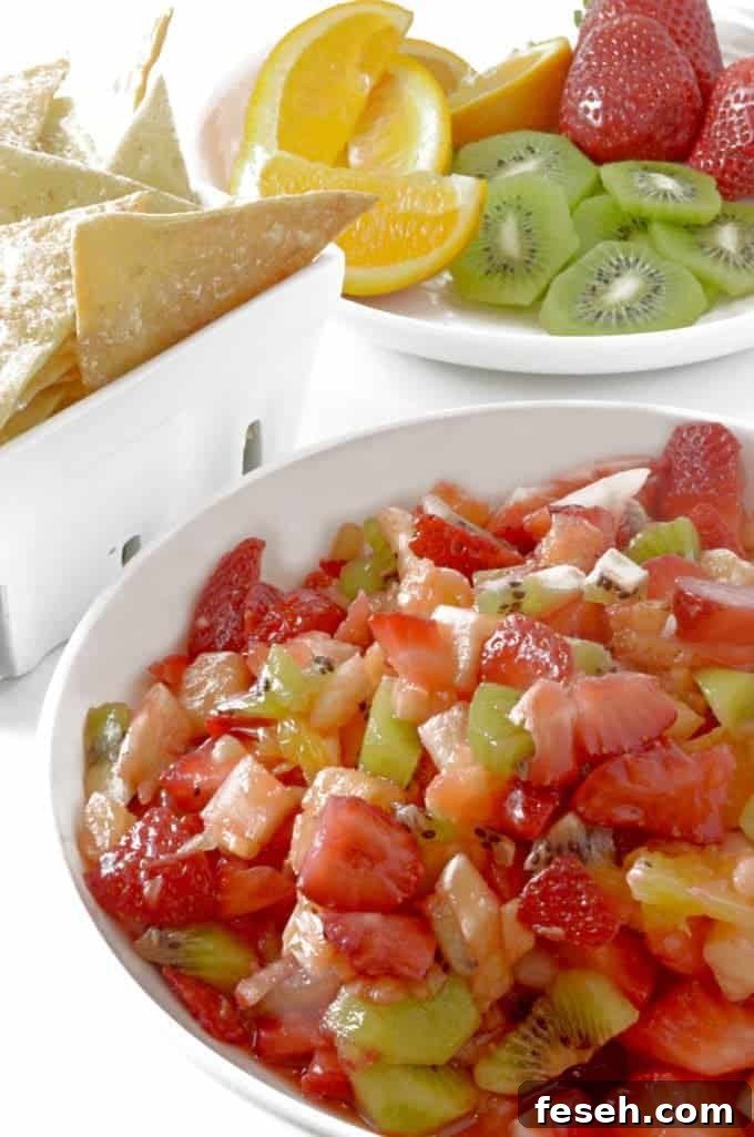 Summer Fruit Salsa with Cinnamon Butter Tortilla Chips 5 A closeup of a salsa bowl with kiwi and chips