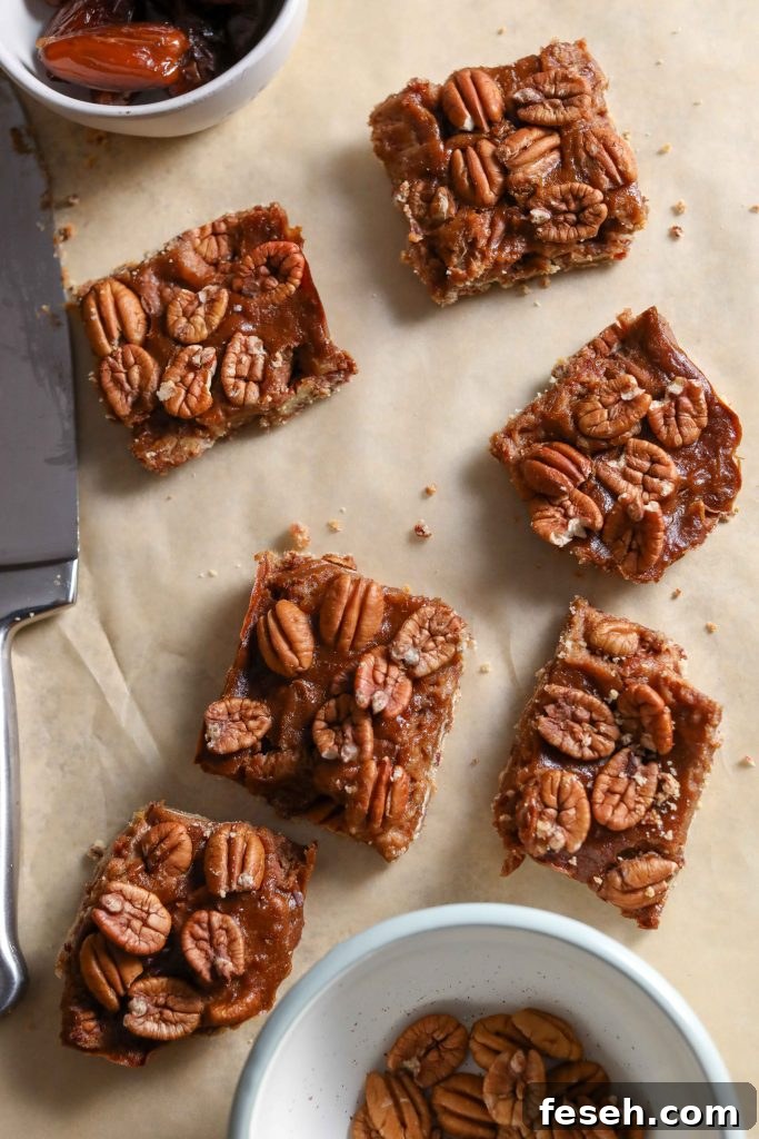 pecan pie bars sliced on parchment paper