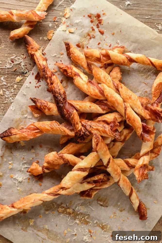 pile of puff pastry twists with prosciutto and parmesan.