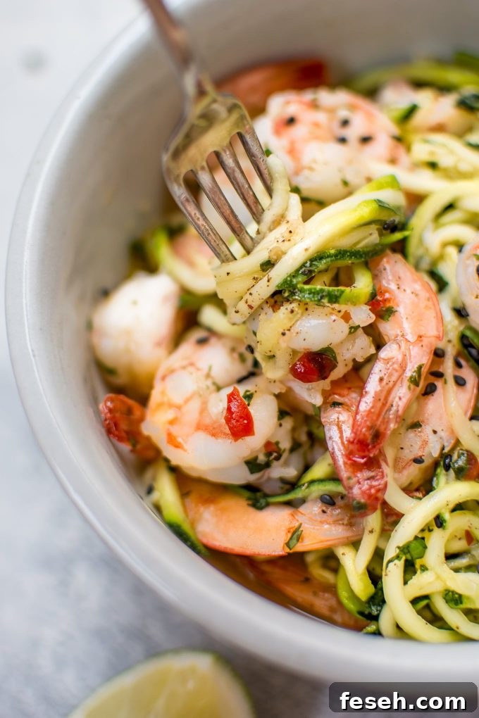 15-Minute Sweet Chili Shrimp with Zoodles Recipe 5 close-up of sweet chili shrimp zoodles on a fork