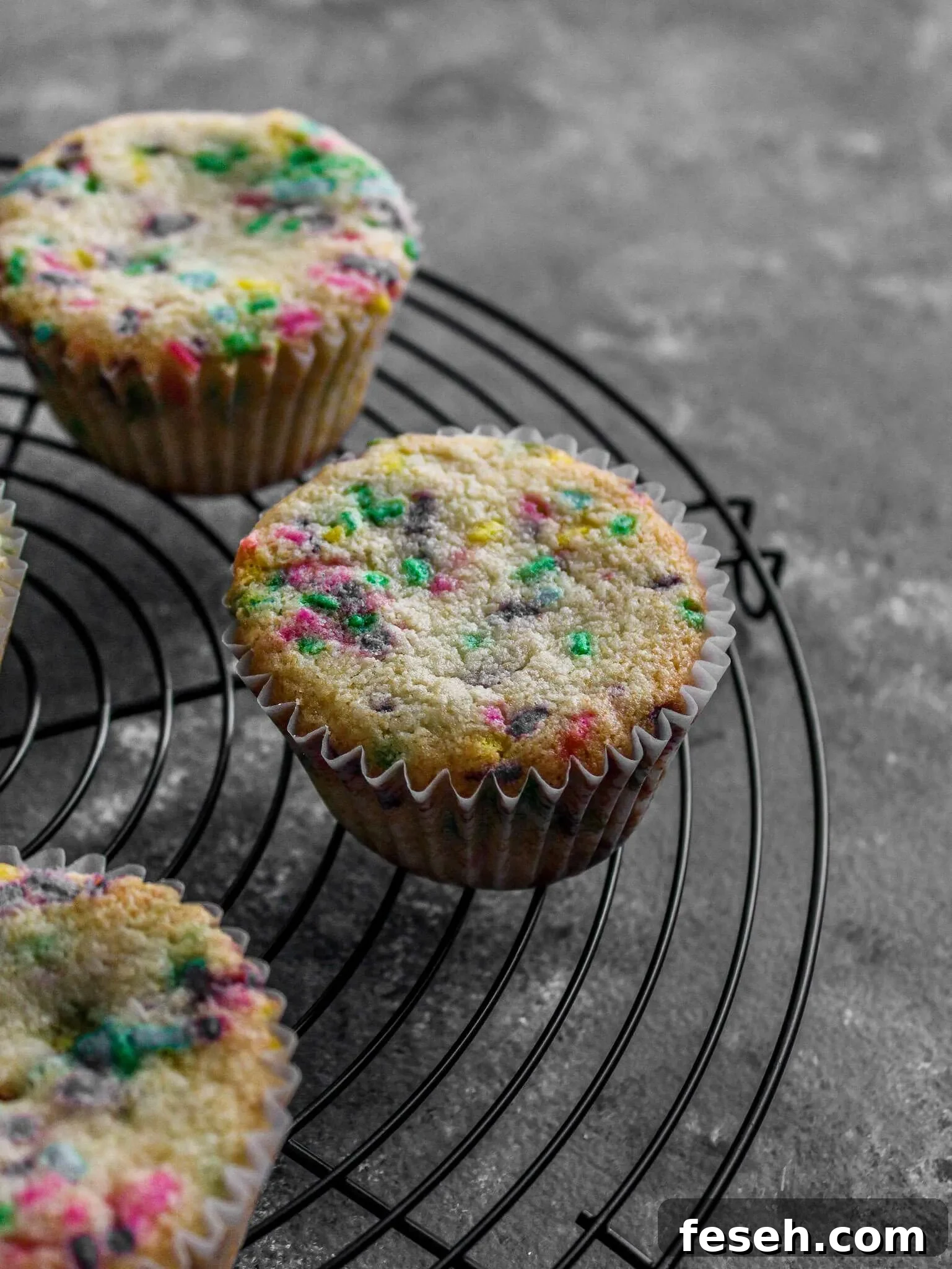 Classic Funfetti Cupcakes with Vanilla Frosting 10 funfetti cupcakes on wire rack